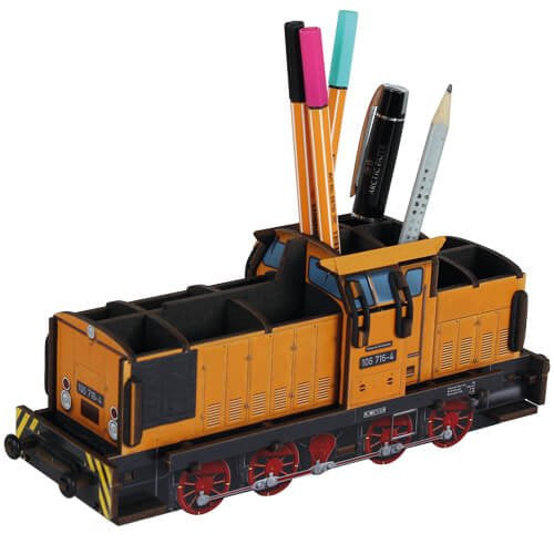 Train-shaped pen holder with stationery items on a white background