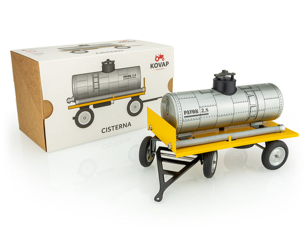 A kovap toy cistern trailer made of metal with a yellow base and gray tank, displayed next to its packaging box, labeled as a 'KOVAP' product.