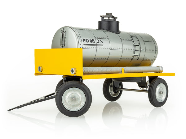 A kovap toy cistern trailer made of metal with a yellow base and gray tank