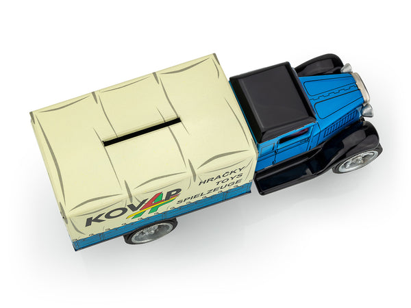 Toy truck with a beige trailer and blue body on a white background