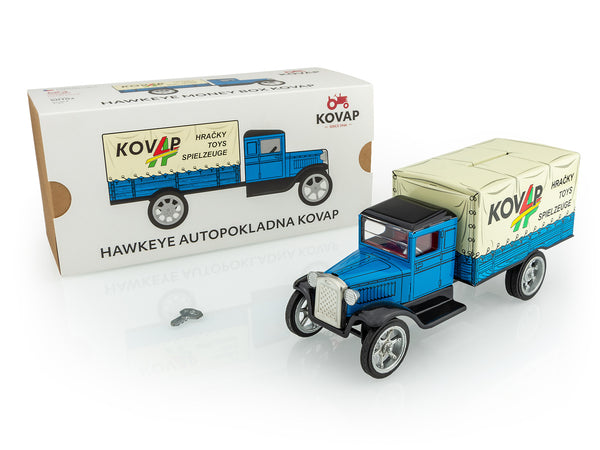 Kovap toy truck with a box in the background