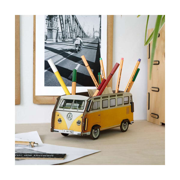 Yellow Volkswagen camper van desk organizer with pens on a desk.