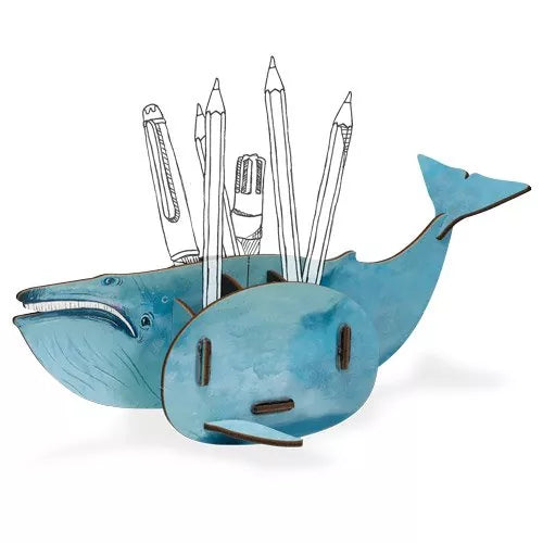 A blue whale-shaped pen pot with multiple compartments filled with various pens and pencils.