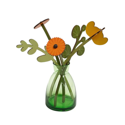 Decorative flower arrangement with a green vase on a white background