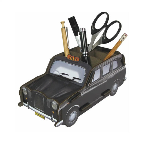 Taxi-shaped desk organizer with stationery items on a white background