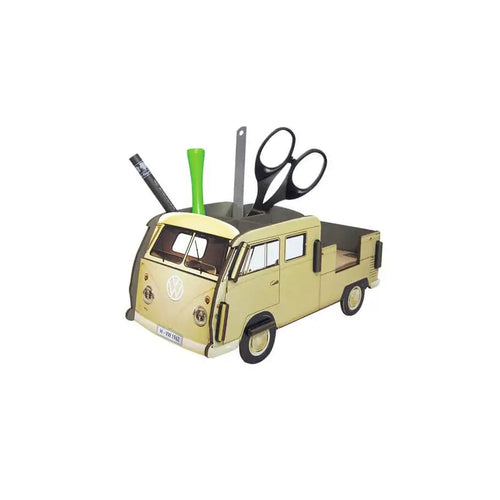 Gold van-shaped desk organizer with scissors and pens on a white background