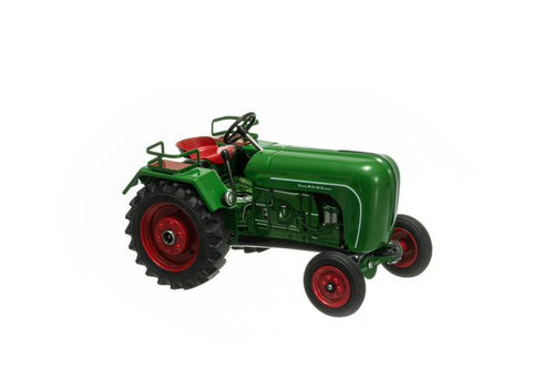 A green and red Allgaier AP16 toy tractor with a metal body, visible steering wheel, and wheels suitable for play.