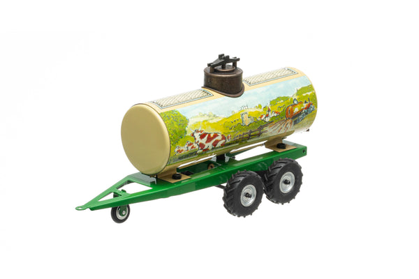 A toy kovap liquid manure trailer with green chassis and multicolored tank, featuring printed farm and tractor graphics.