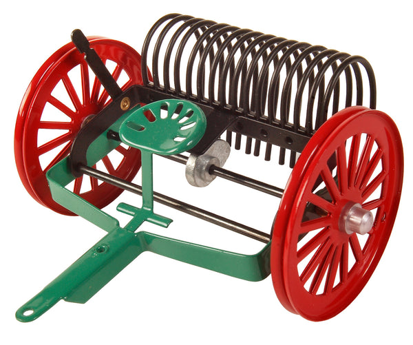 A kovap toy rake with red and green colors, made of plastic, designed for children's play.