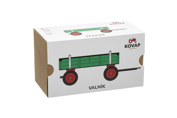 A green and red toy trailer with a folding tailgate box