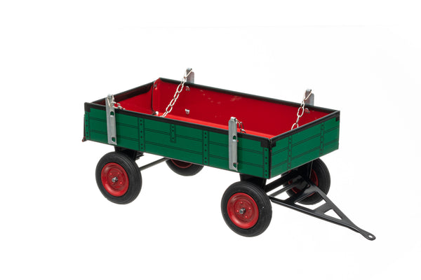 A green and red toy trailer with a folding tailgate, suitable for children and collectors, made with handmade craftsmanship.