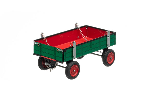 A green and red toy trailer with a folding tailgate, suitable for children and collectors, made with handmade craftsmanship.