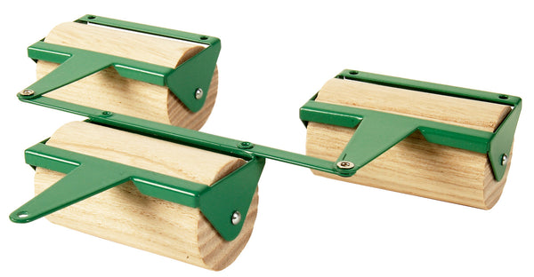 Two wooden rollers with green and silver colours, designed for use in agricultural machines, exhibiting fine craftsmanship.